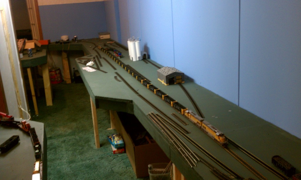 model railroad laying track for bridge