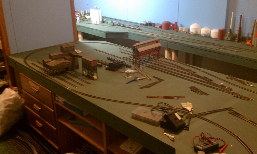 model railroad laying track for bridge