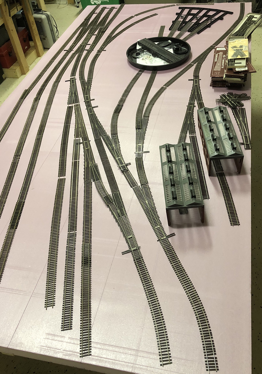 model railroad laying the track