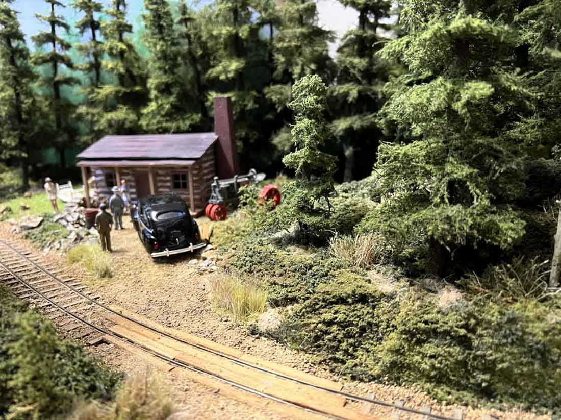 model train log cabin