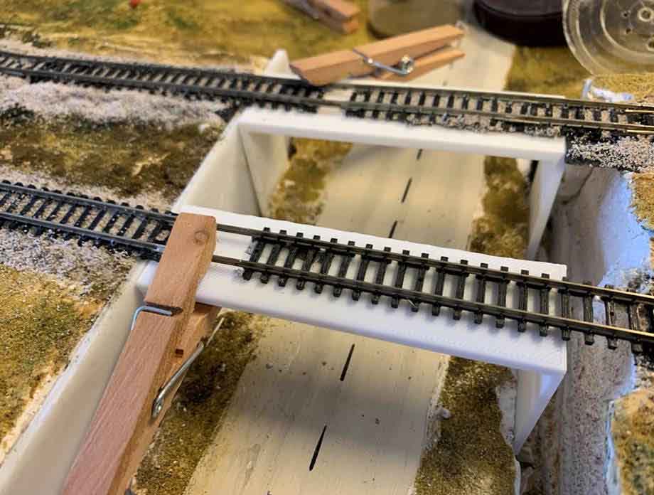 model train inclines bridge