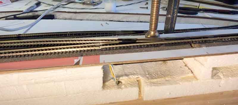 placing HO scale switch machine on track
