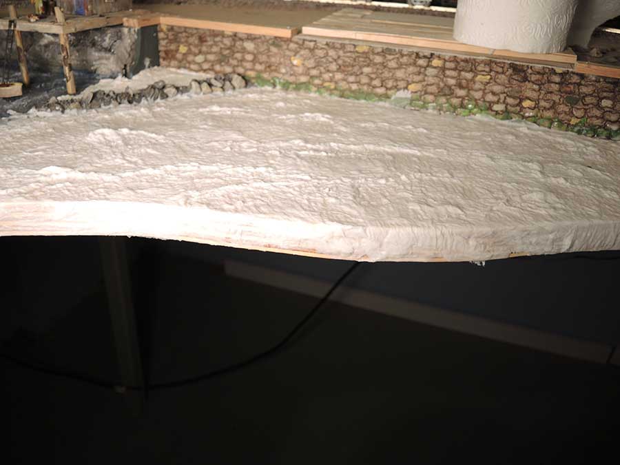applying plaster for model railroad water