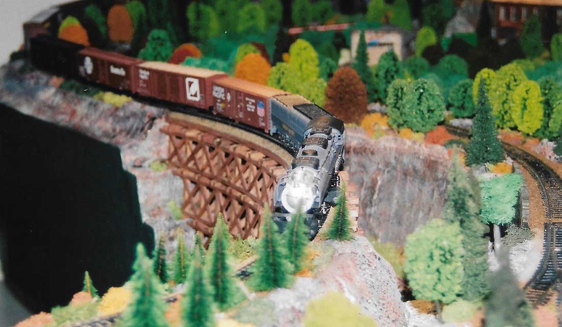 model train crossing trestle bridge