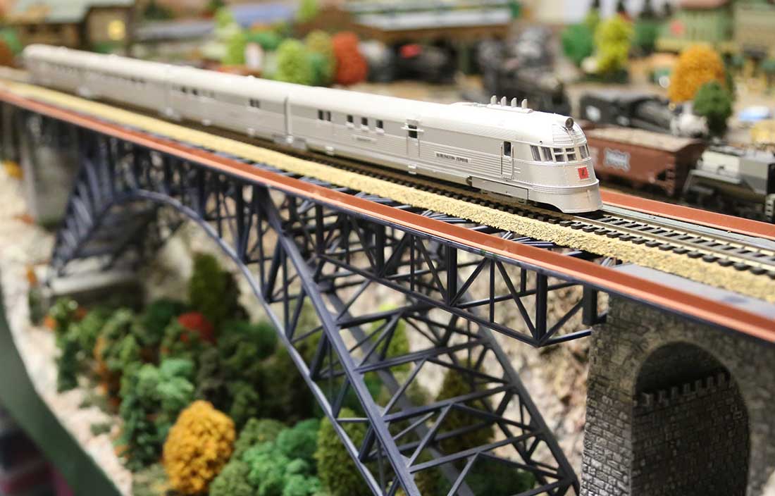 model train locomotive crossing bridge