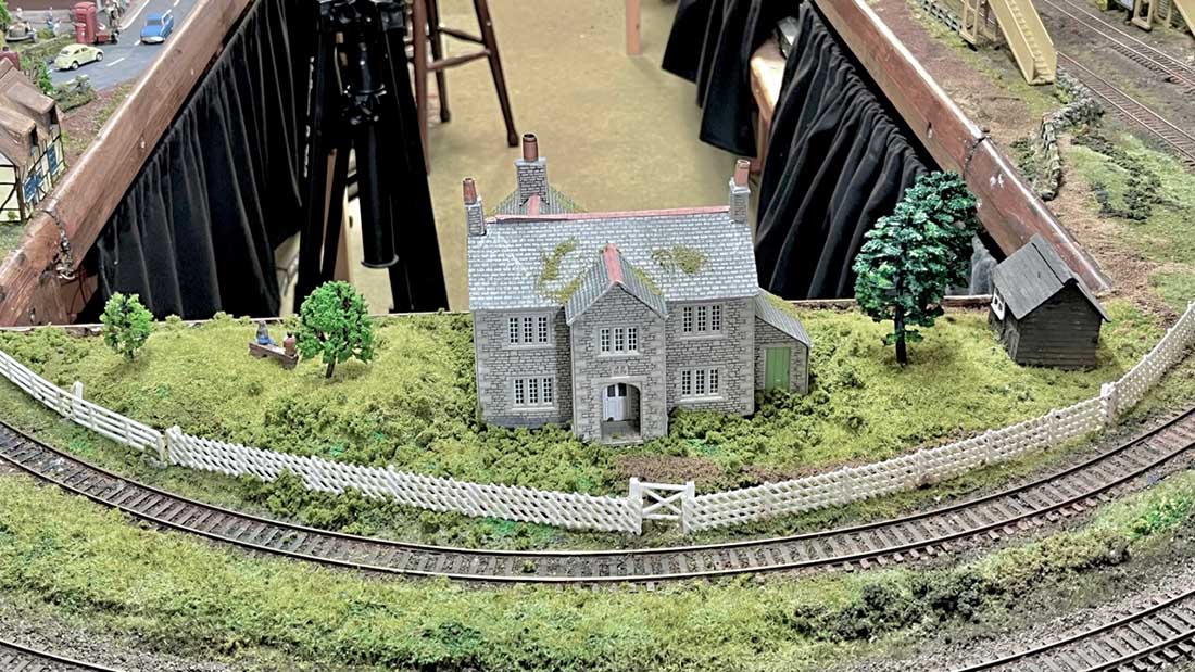 model railway end curve house scenery