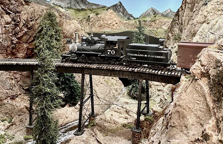 Battery power for model trains on trestle bridge