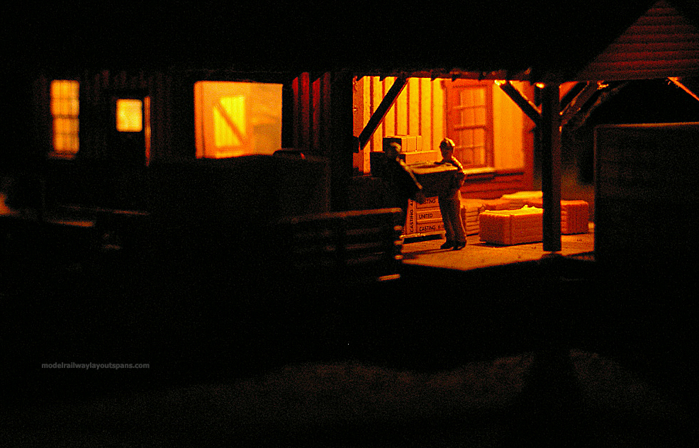 model train track side loading platform night