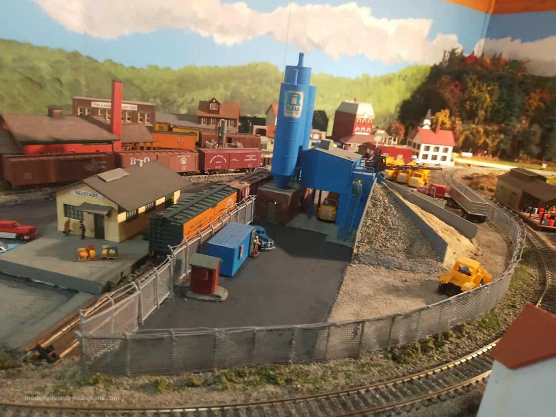 model railroad track curve around cement factory