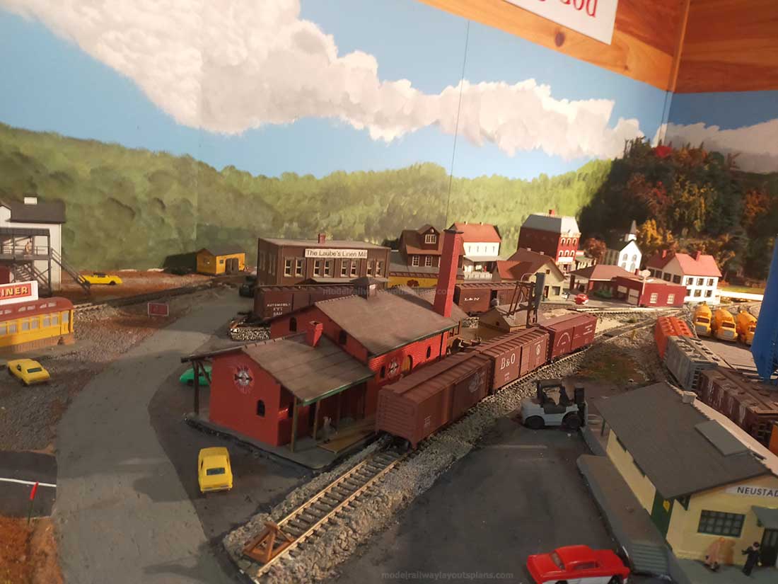 model railroad wooden freight yard by track