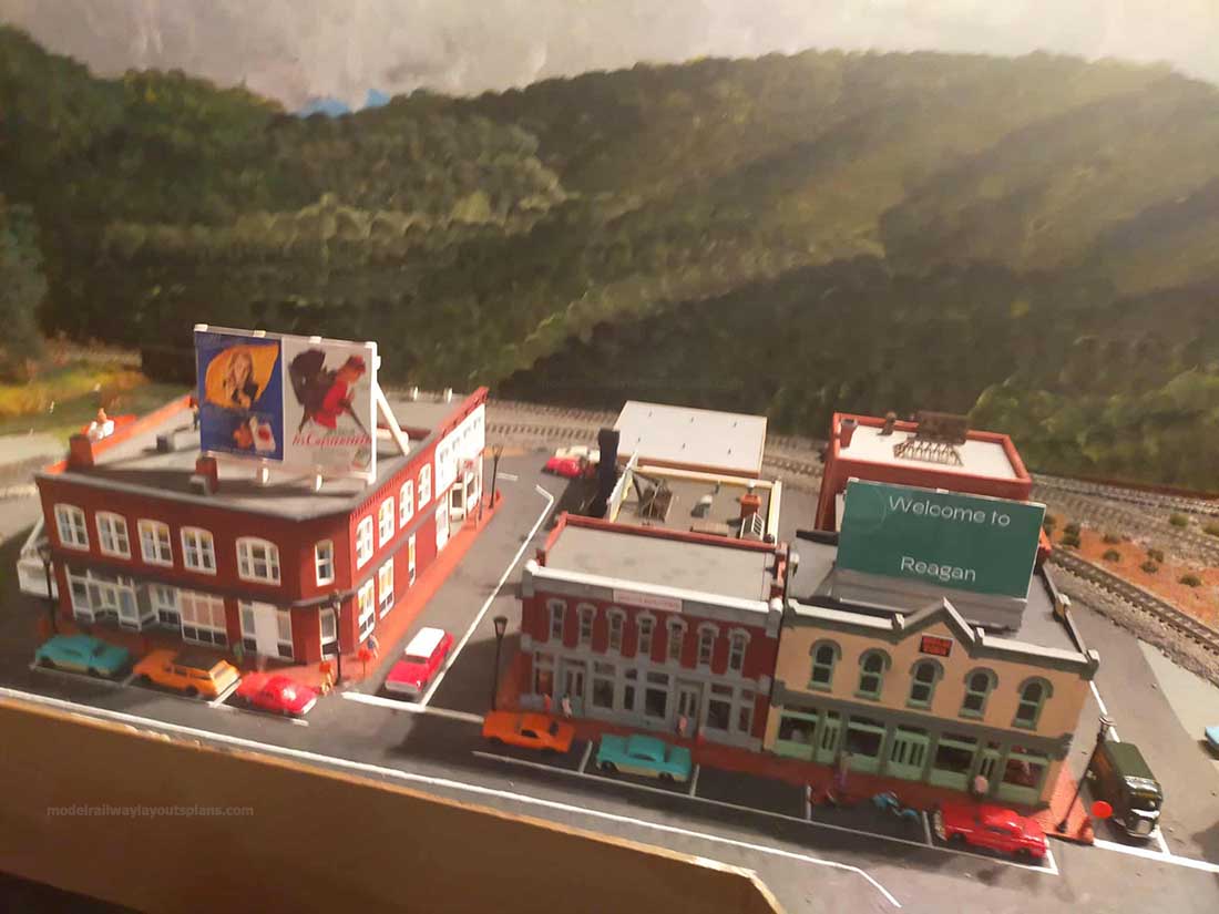 model train track side buildings