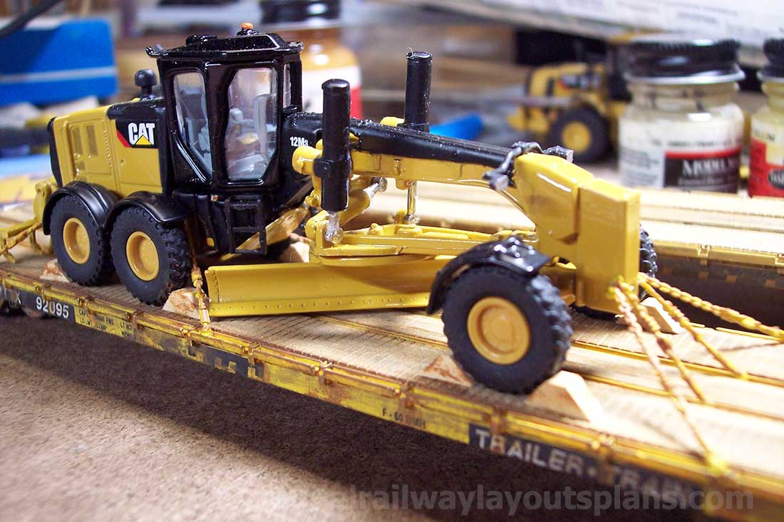 HO scale flatbed freight in train yard